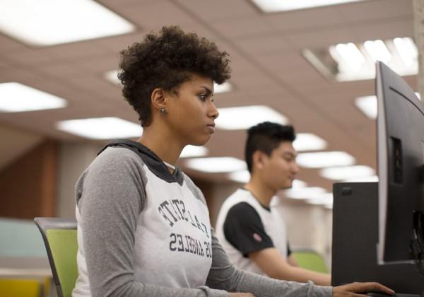 A student using a desktop computer.